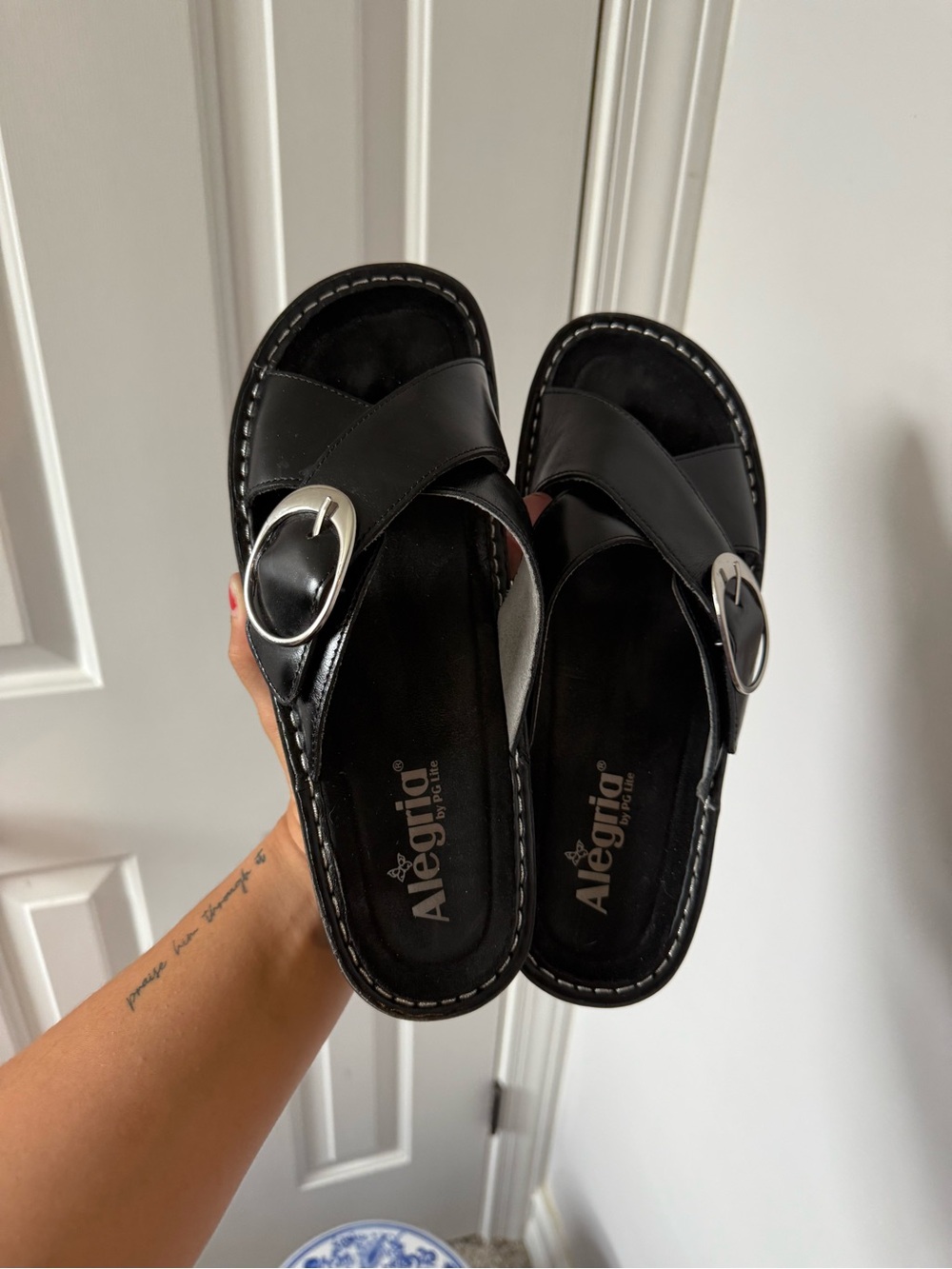 Alegria Vanya Black Leather Slide Sandals with an adjustable buckle strap